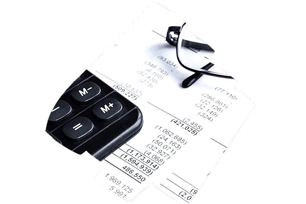 A close-up image of a financial report with rows and columns of numbers indicating expenses and cash flow. A calculator and a pair of glasses are placed on top of the document, suggesting active analysis or review.